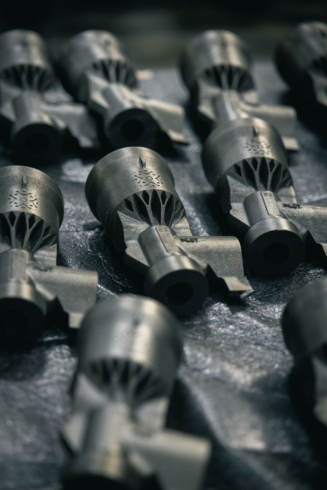 Close-up view of a Rutherford engine showing its compact 3D-printed Inconel construction and electric pump-fed architecture