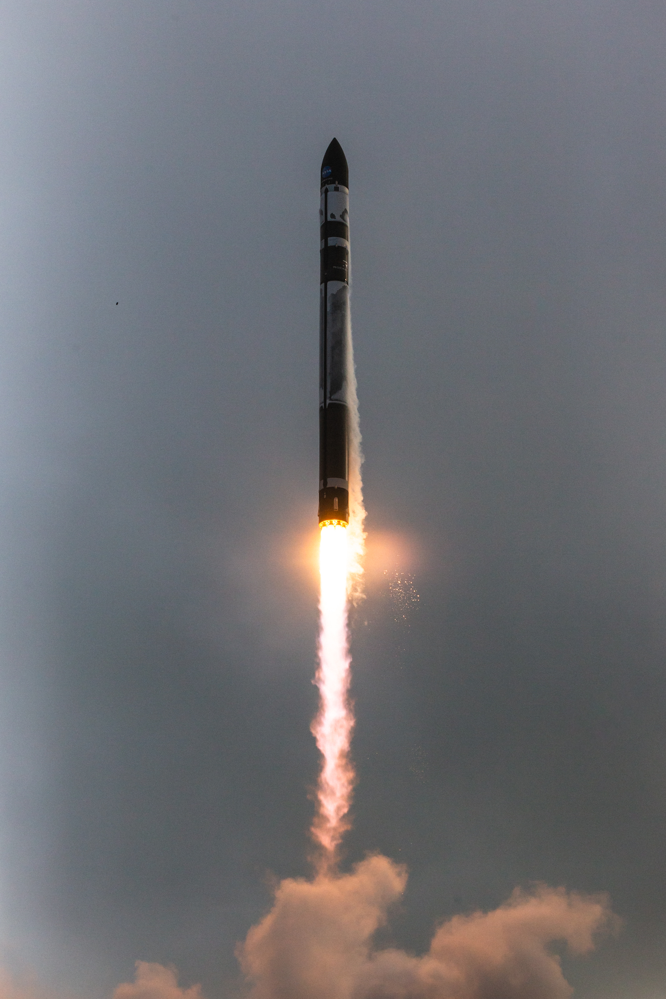 A Rocket Lab Electron rocket lifting off, powered by nine 3D-printed Rutherford engines in its first stage