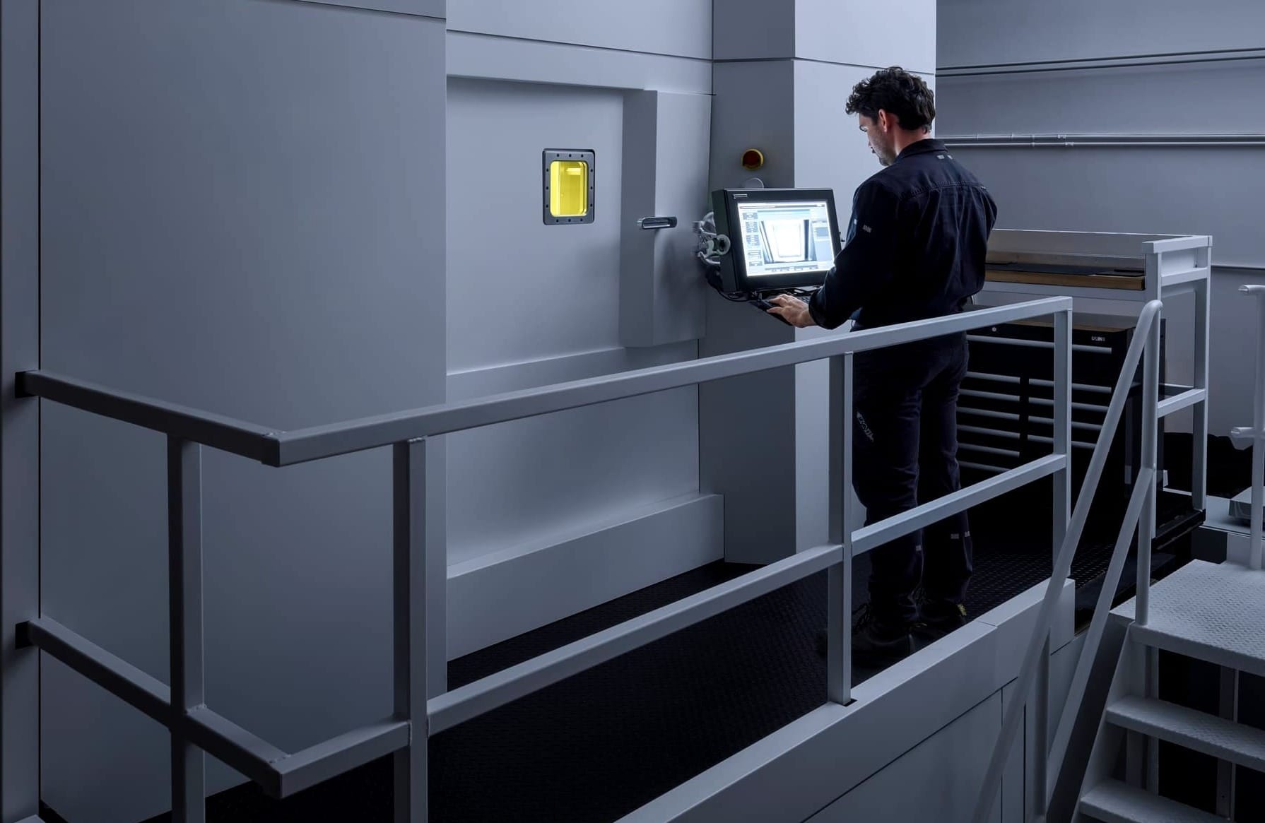 Close-up of the Monolith One's human-machine interface showing the 12-laser configuration and system controls