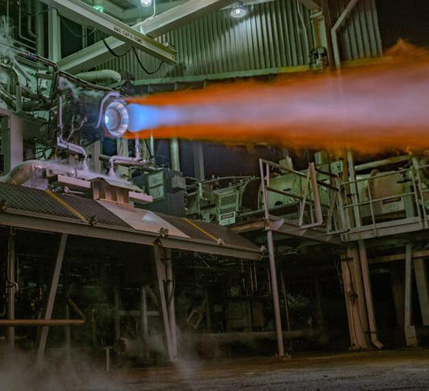 3D printed RL10 rocket engine combustion chamber undergoing testing
