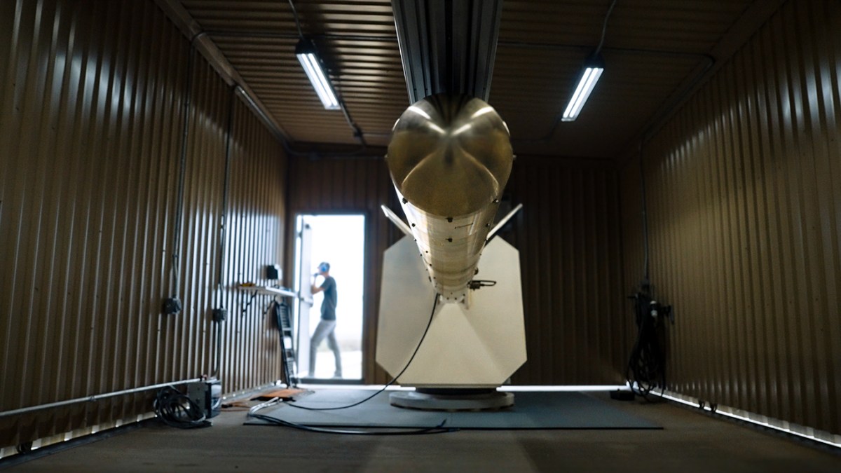 Venus Aerospace's rotating detonation rocket engine firing during testing, showing the annular combustion chamber that requires LPBF-manufactured conformal cooling channels